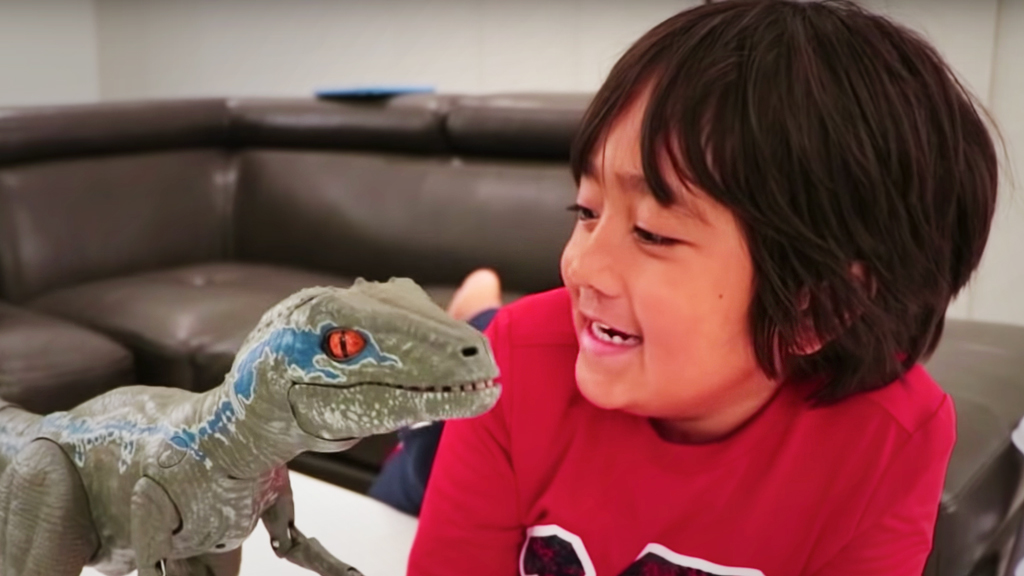 boy with toy dinosaur
